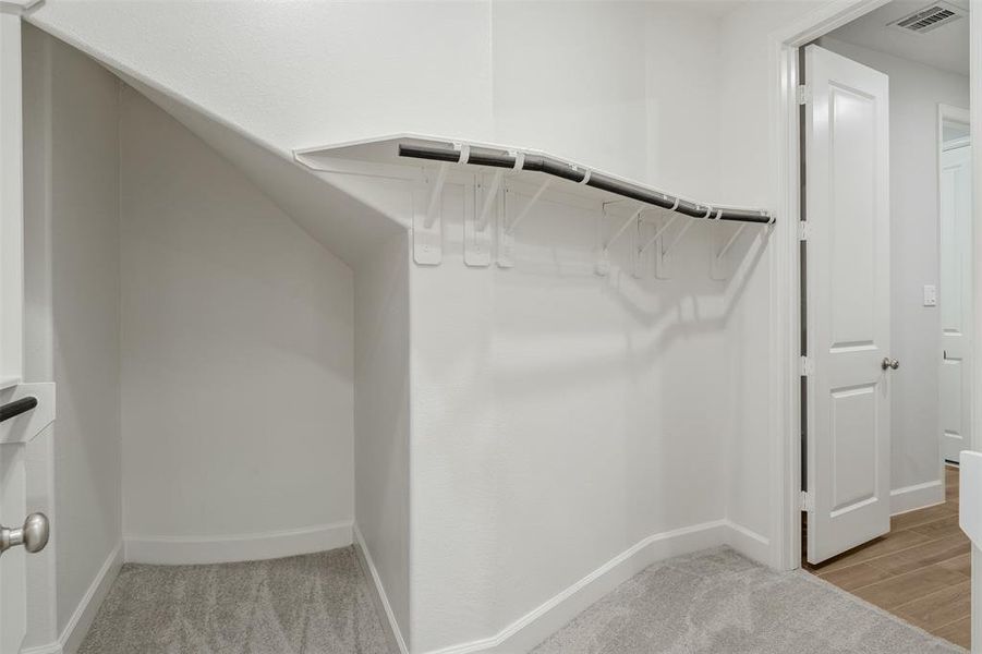 Primary Closet passthrough to Laundry Room. There is an additional Walk-In Closet