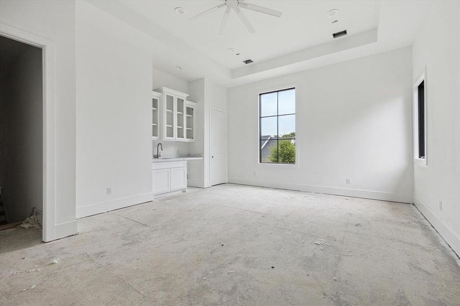 A peak inside the 22 x 16 game room with beverage center and gorgeous natural light.  This space is completely flexible to meet the needs and wants of your family.  You will love it!  Photo as of 9/3/2024