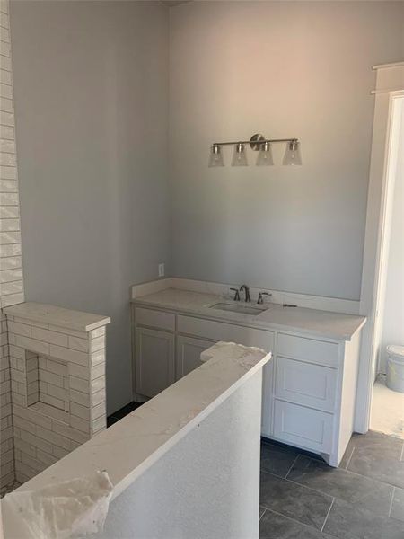 Bathroom featuring vanity and toilet