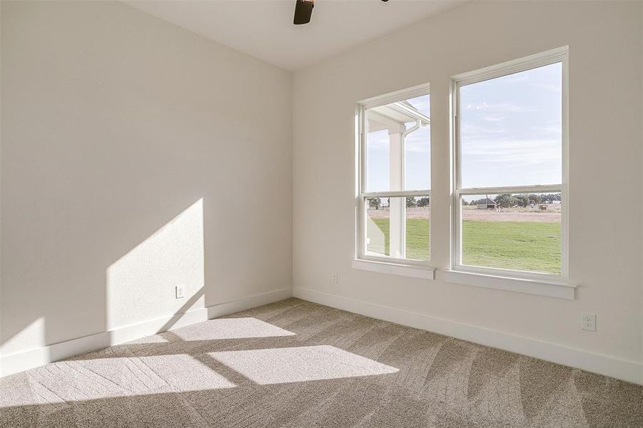 Unfurnished room with light colored carpet