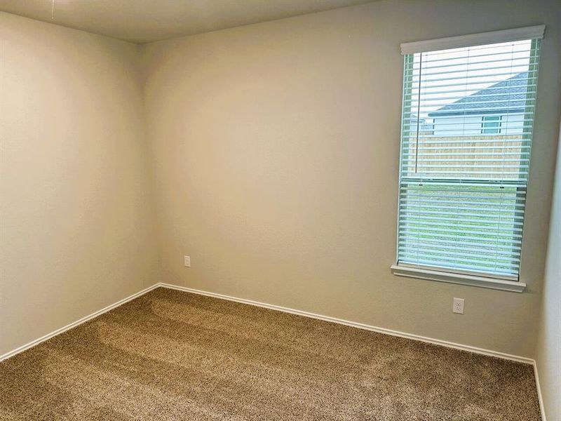 Bedroom 2 is cozy with plenty of natural light!