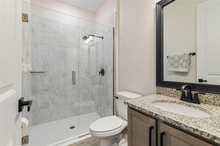 Bedroom 2's Ensuite with Glass Shower and Rain Shower Head.