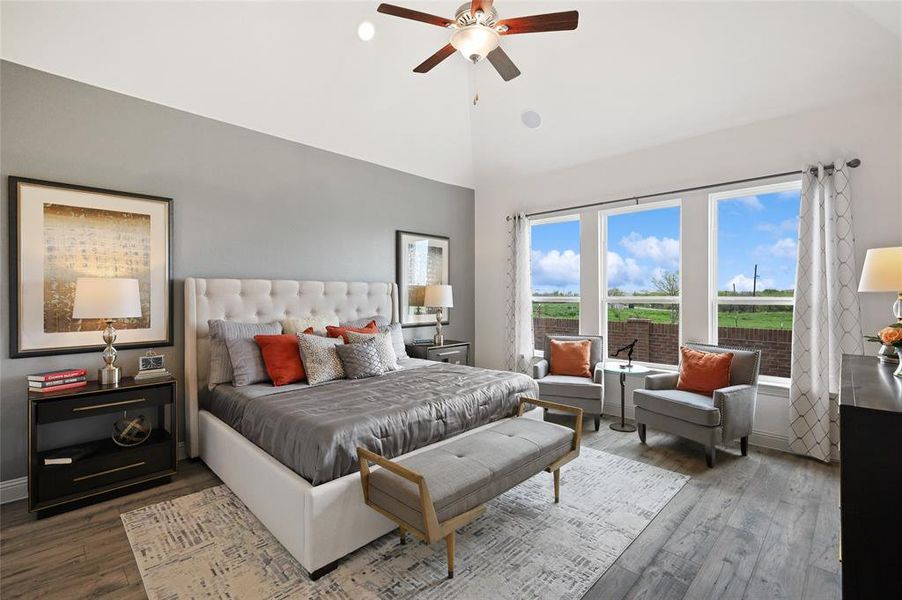 Bedroom featuring ceiling fan, high vaulted ceiling, and hardwood / wood-style flooring