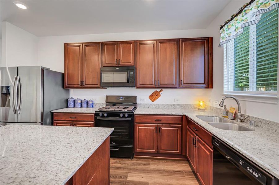 Kitchen with Granite countertops and gas stove