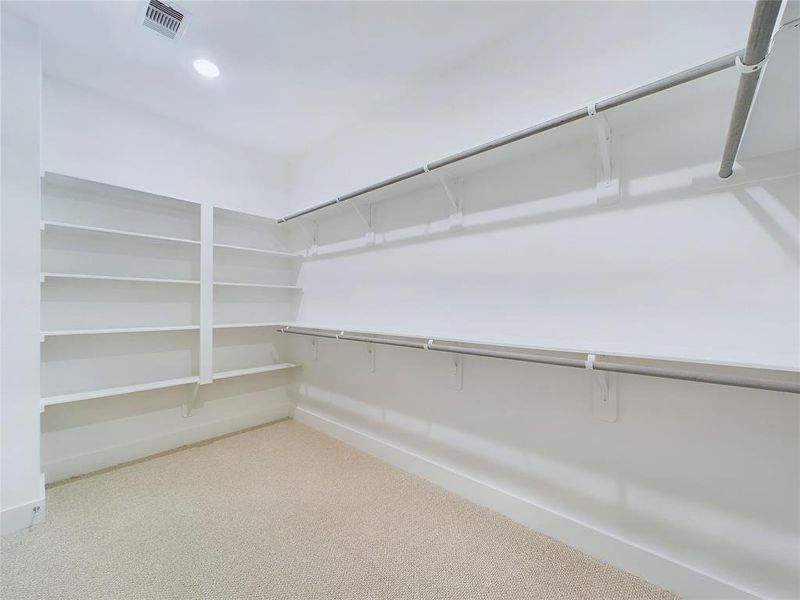 Large Walk-In Closet in Primary Bedroom. Model home photos, finishes and floor plan MAY VARY!