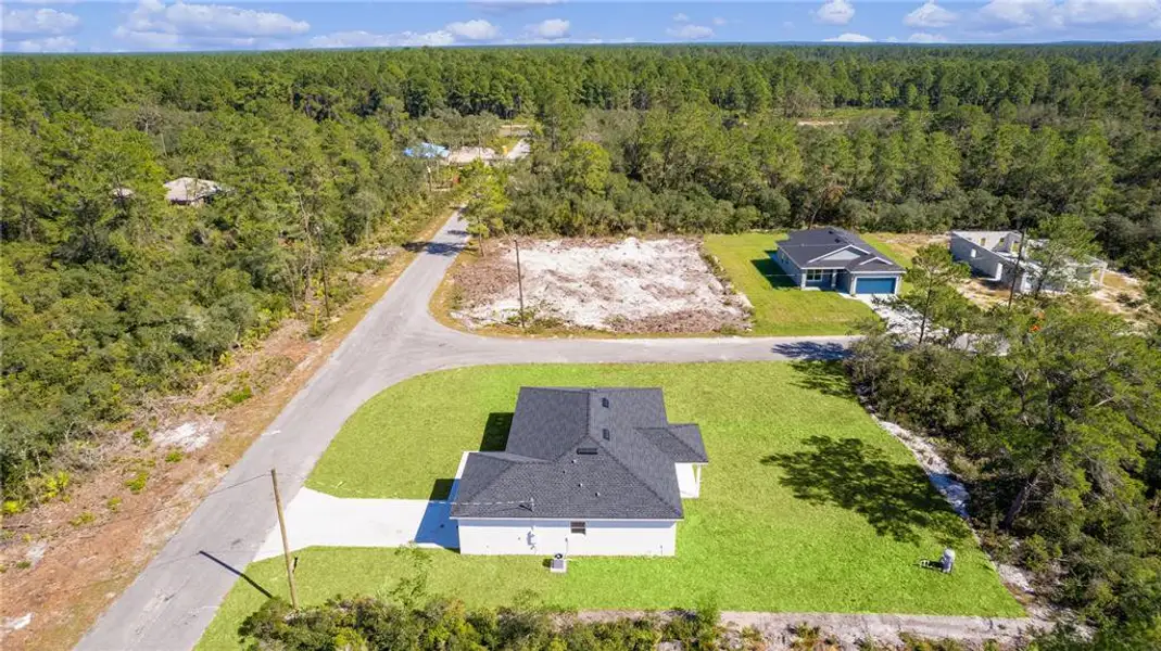 Aerial view looking across the property towards Fisher Road