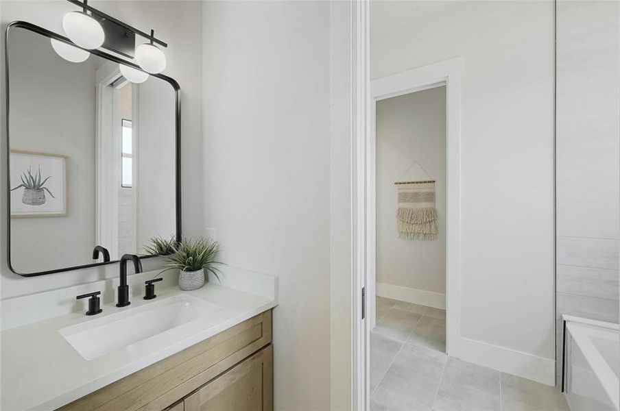 Jack and jill bathroom with tub/ shower area