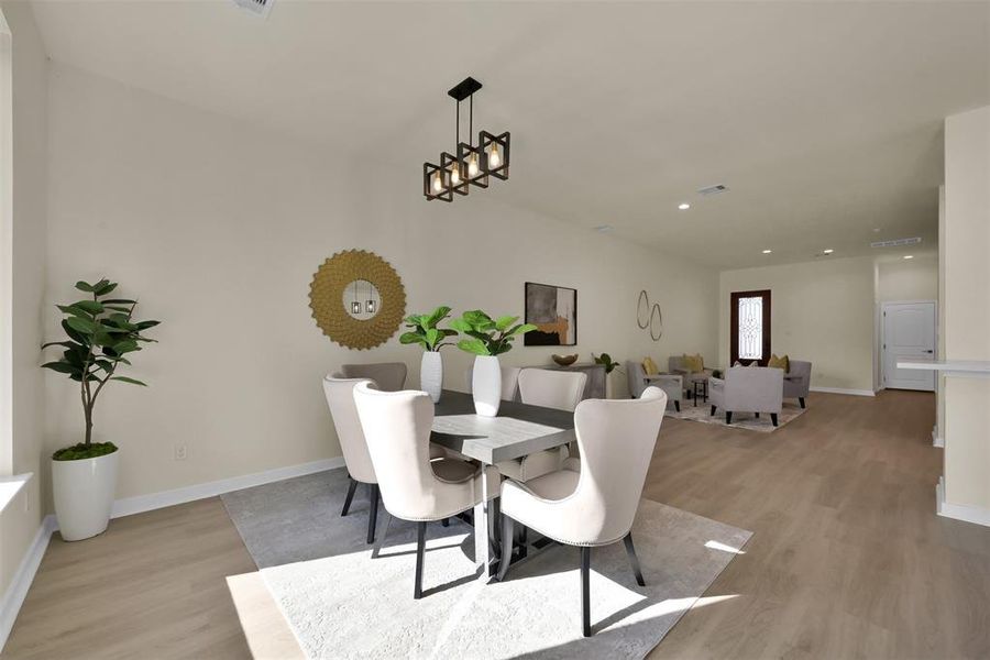 Dining space is also open to the living space and features a large window for plenty of natural light.