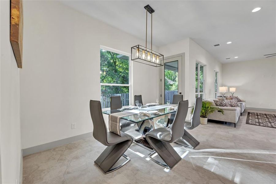 Extravagant dining area with all the natural light flowing in.