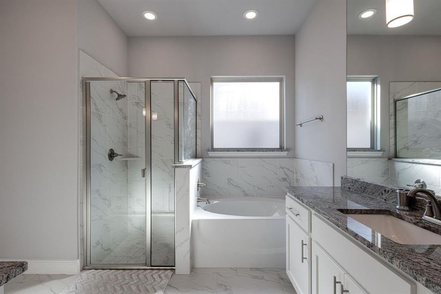 Bathroom with vanity and plus walk in shower