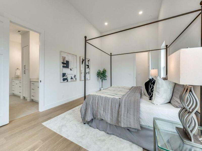 Bedroom featuring connected bathroom and light hardwood / wood-style floors