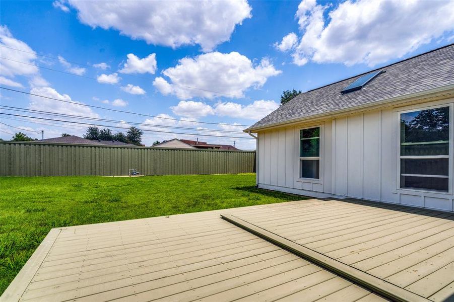 Huge yard with a brand new eight foot fence enclosing the yard.  Please notice that the primary bedroom has its own skylight and the brand new roof and windows complete the package!