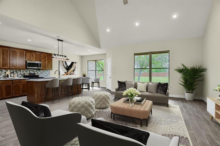 Living room with high vaulted ceiling and light Tile Plank flooring