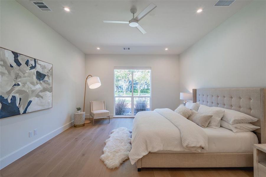 Bedroom featuring ceiling fan, access to outside, and light wood-type flooring