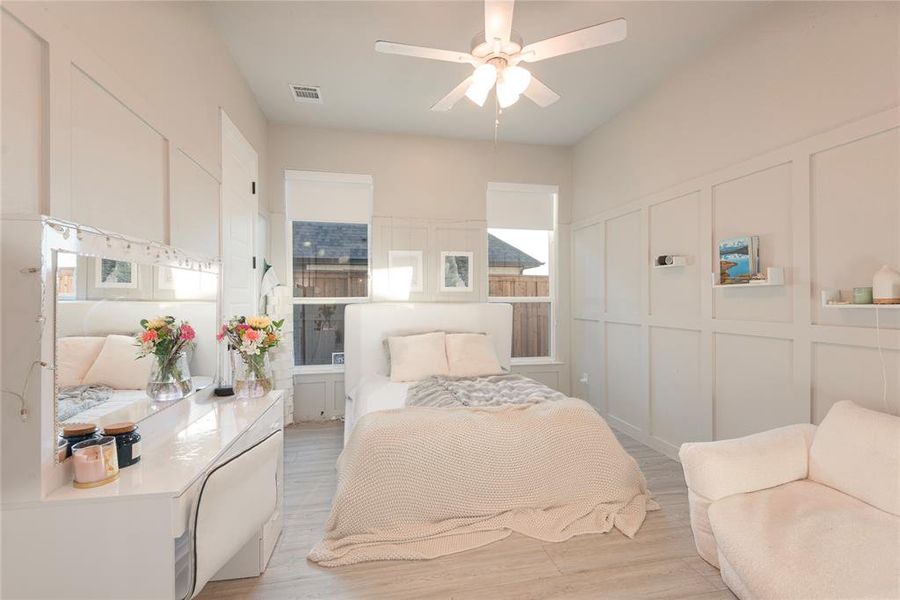 Bedroom featuring light wood-type flooring and ceiling fan