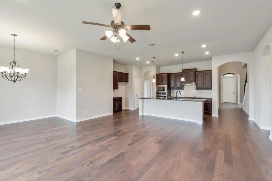 Family Room to Kitchen | Concept 2671 at Oak Hills in Burleson, TX by Landsea Homes