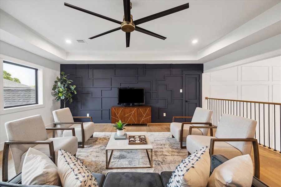 Designer touches are everywhere in this custom home, including this stunning accent wall. It's a fantastic room for relaxation.