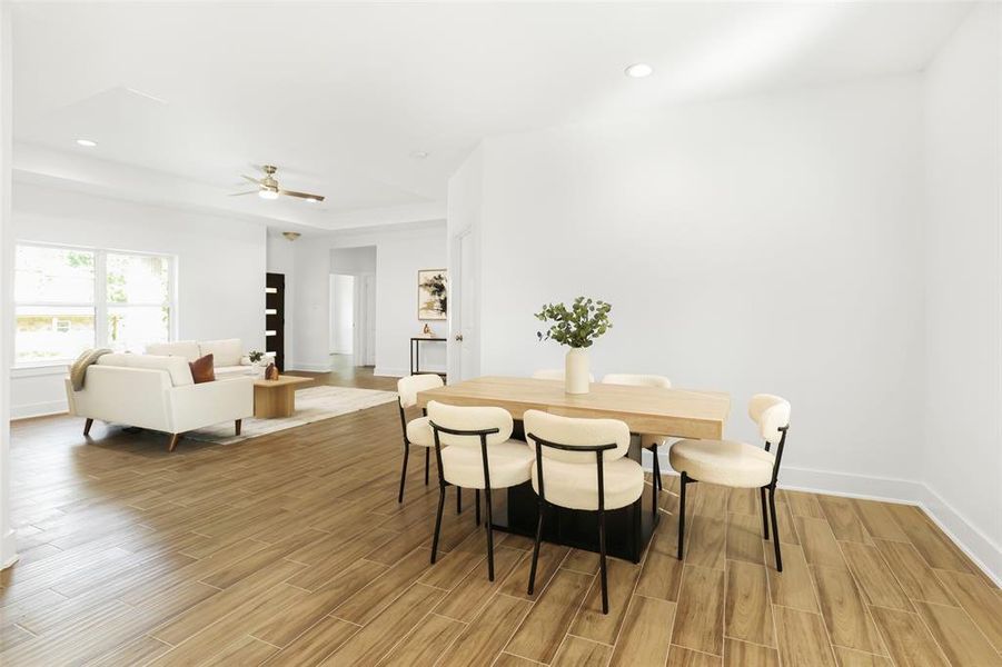 The spacious dining area, seamlessly connected to the kitchen, is perfect for entertaining and family gatherings.