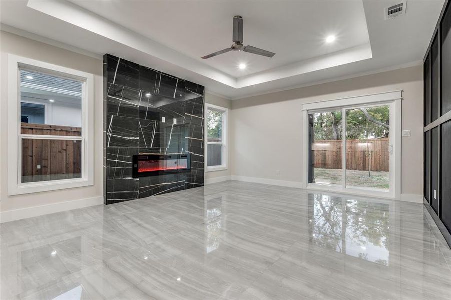 Glossy 24x48 tiles with a breathtaking fireplace, floor to ceiling porcelain tiles.