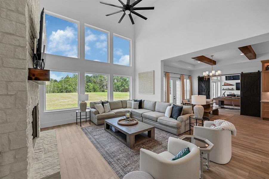 Discover a seamless blend of comfort and style in this open-concept living space, featuring a sunlit family room, a cozy breakfast nook, and a versatile game room adjacent to the well-appointed kitchen.