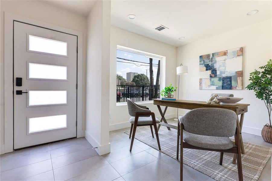 Home office featuring light tile patterned flooring