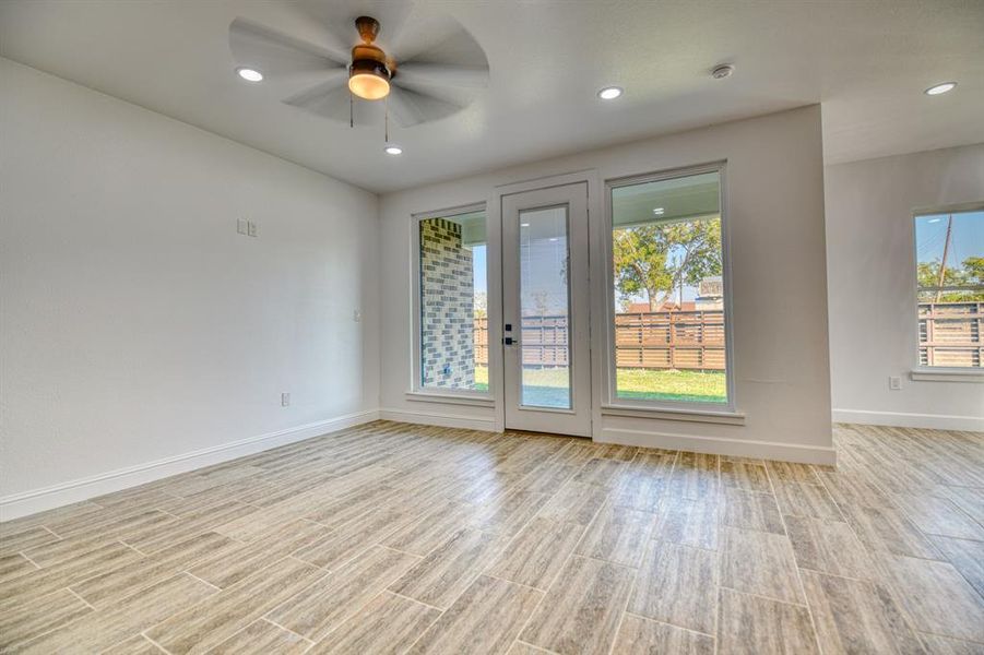 Empty room featuring light hardwood / wood-style flooring and ceiling fan