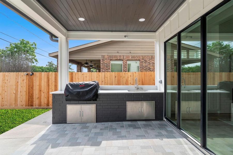 This covered patio will be your summer hang out spot. Enjoy spending time with the family while grilling outside and taking a dip in your pool!