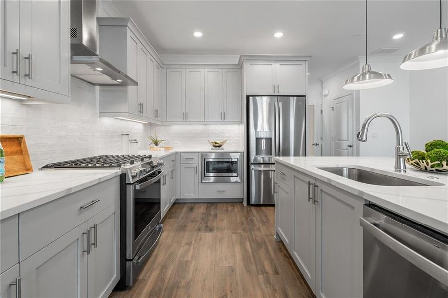 Quarts countertops are just the start of the upgrades offered in this home - Photos shown are of model home for viewing purpose only.