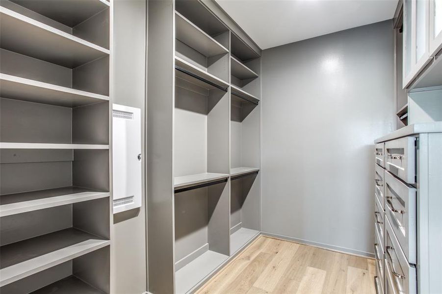 Walk in, custom California closet in primary.