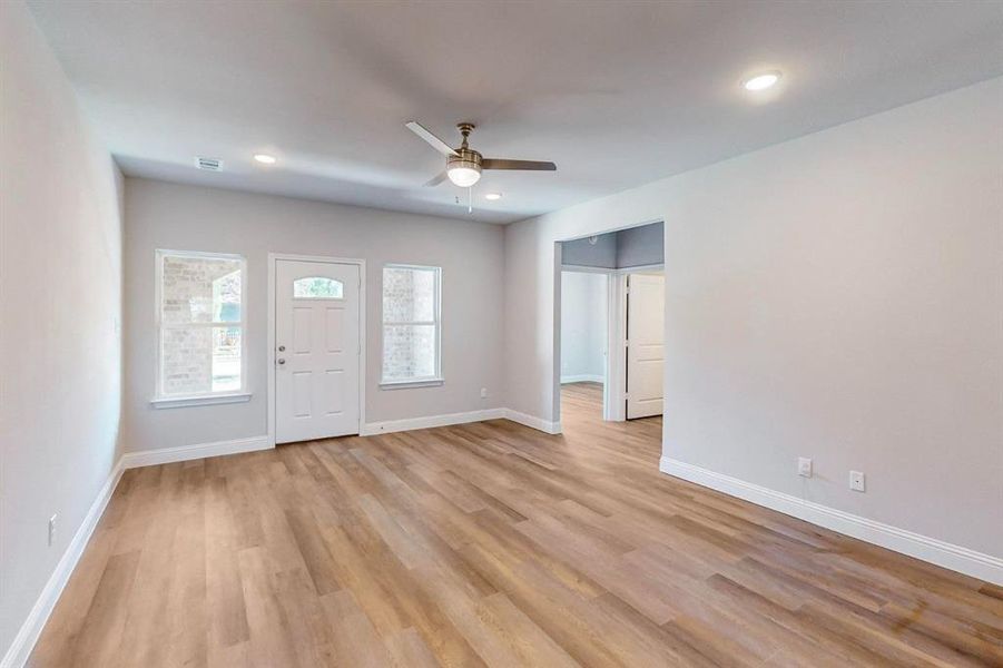 Foyer featuring light hardwood / wood-style floors and ceiling fan