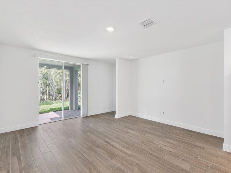 Living room in the Everglade floorplan at 232 Links Terrace Blvd