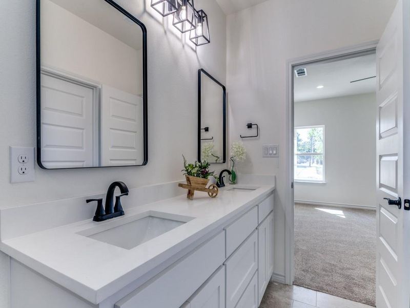 Bathroom with vanity and tile patterned flooring