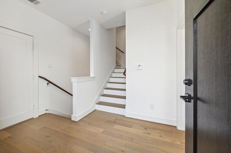 Bedroom to your right, clean white paint brightens this home.