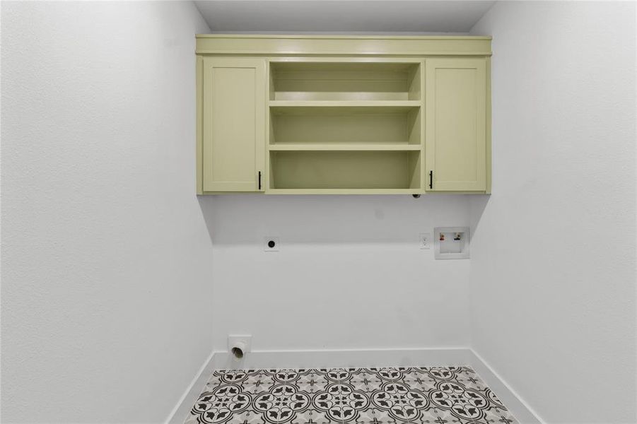 Washroom featuring hookup for a washing machine, hookup for an electric dryer, and tile patterned flooring