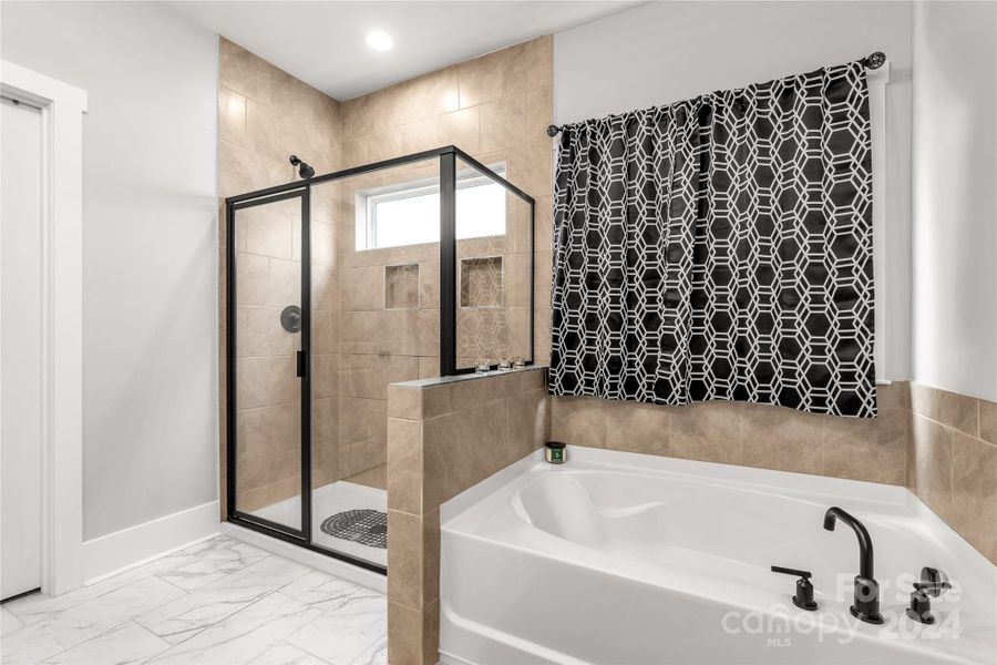 Tiled walk-in shower and soaker tub