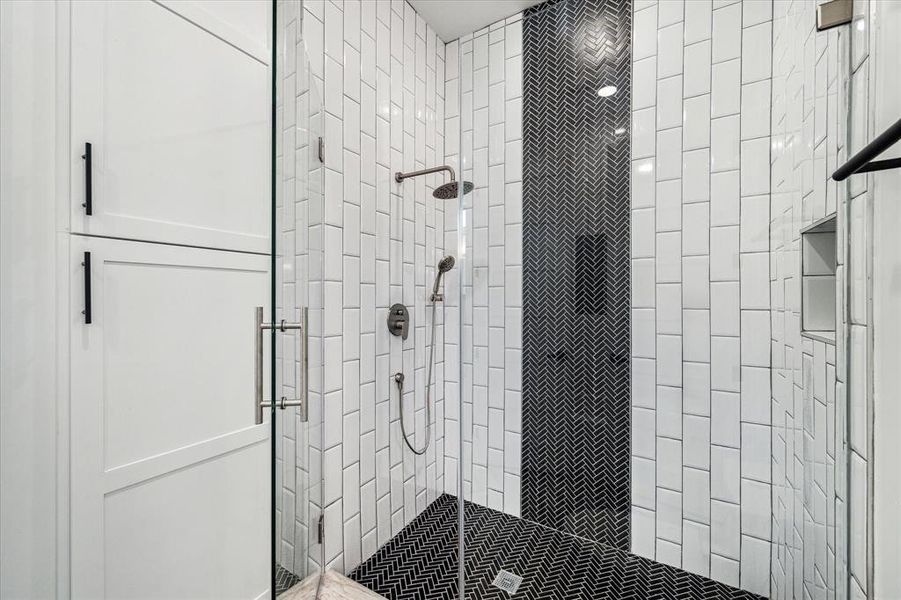 Walk- in shower that is connected between bedroom 1 and 2