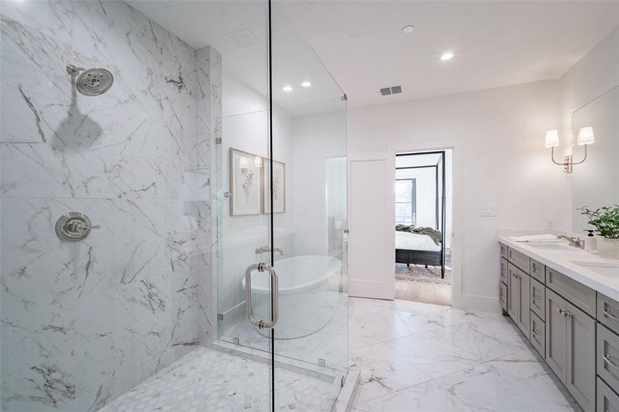 Bathroom with double vanity and separate shower and soaking tub