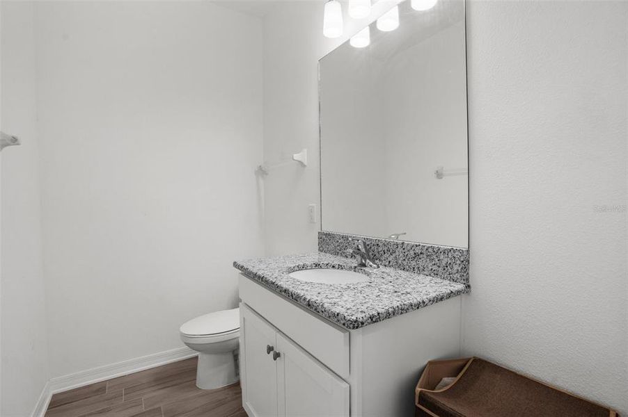 Downstairs FULL bathroom. Shower behind door.