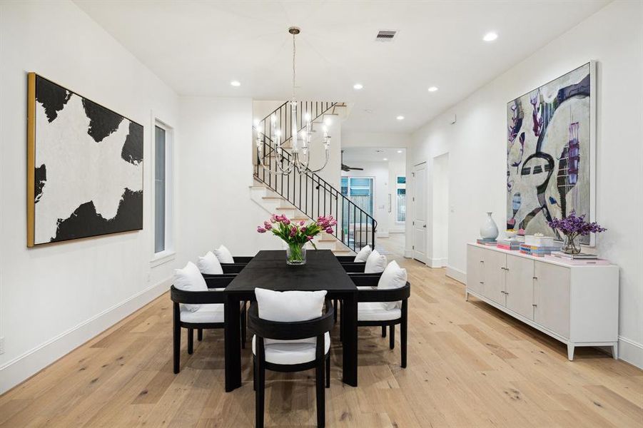 View from the Formal Dining Room towards the Gorgeous Staircase with Simple but Elegant Wrought Iron Railing.