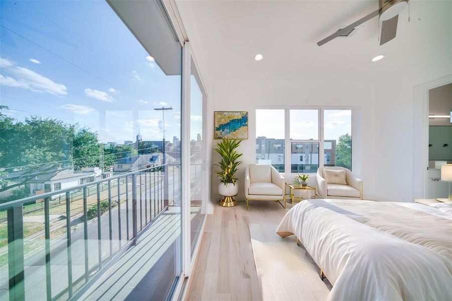 Bedroom with light hardwood / wood-style flooring, access to exterior, and ceiling fan