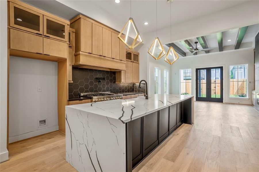 This is your incredible kitchen that seamlessly flows into the living space. Seats 4-6 people comfortably at this island.
