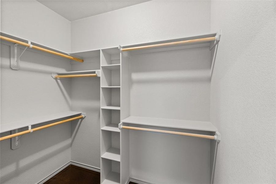View of spacious closet in primary bedroom