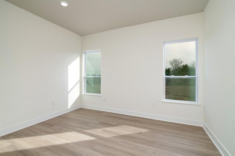 Unfurnished room featuring light wood-type flooring