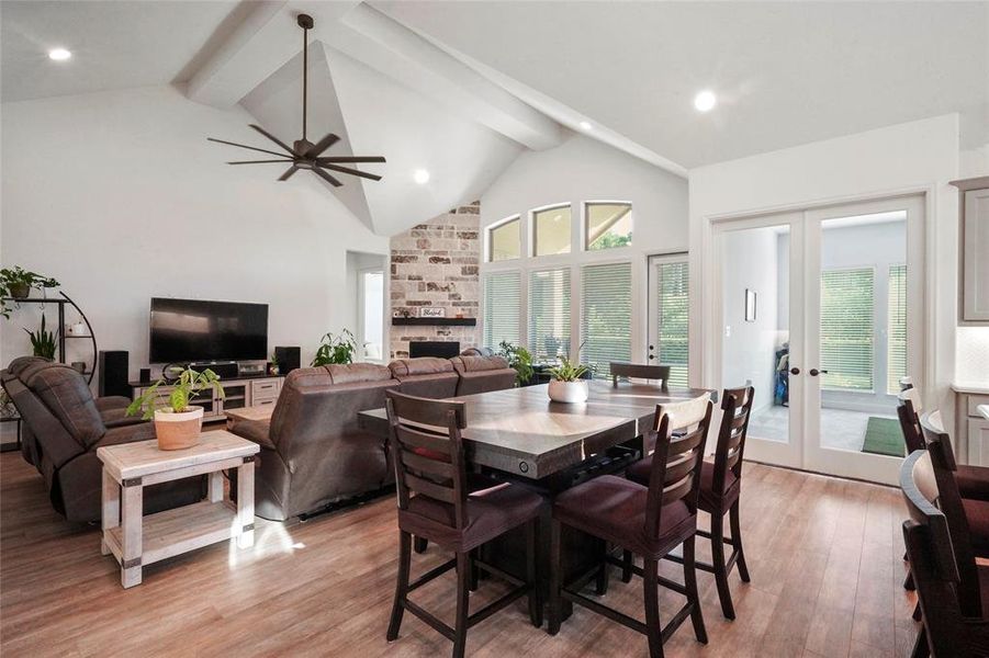 Another view of the living room & dining area. The double French doors lead to the game room. The Seller converted this room to his "golf practicing room". The golf simulator is excluded from sale.