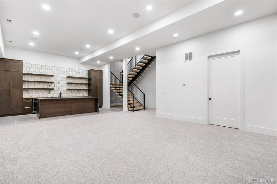 Basement with wet bar and wine room