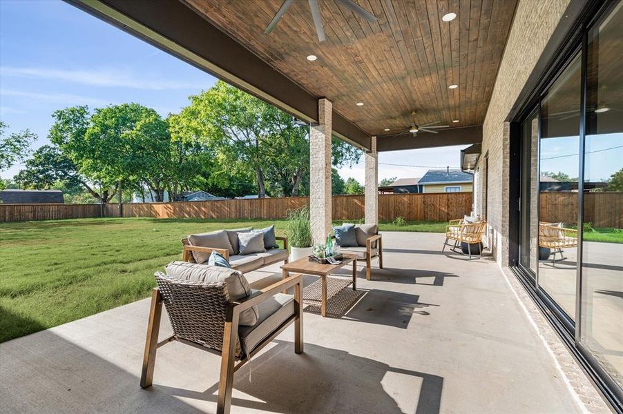 View of patio / terrace with an outdoor living space and ceiling fan