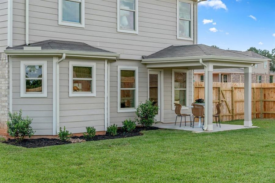 Come and see this spacious backyard with the covered rear patio! There is plenty of room for the kids to play and adults to relax! Perfect for your outdoor living space, patio furniture, bbq pit, and so much more. The possibilities are endless!