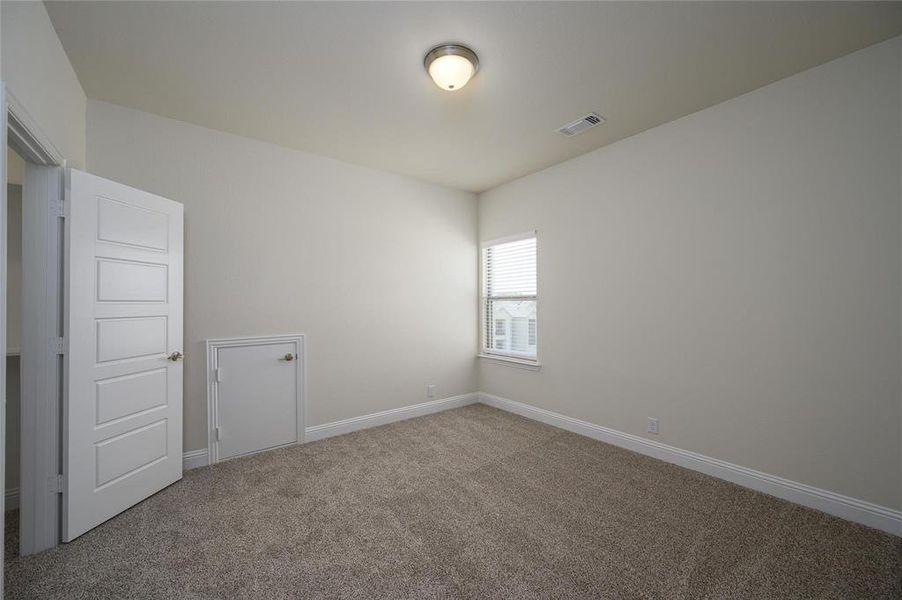 Spare room featuring carpet flooring