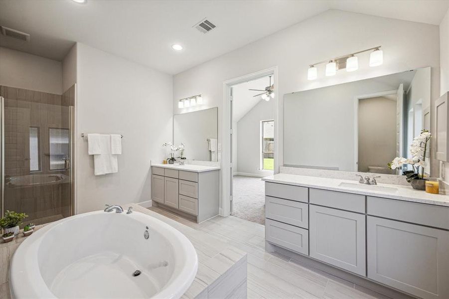 A soaking tub in the primary  bath is like having your own personal oasis—a place where you can escape from the stresses of the day and indulge in some much-needed relaxation.
