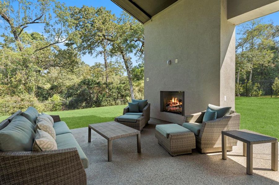 Cozy up with the outdoor fireplace.